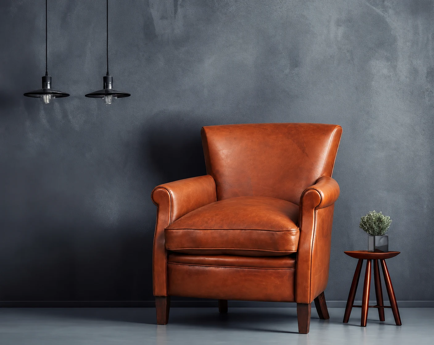 Khiam Cuir cognac leather armchair in a charcoal room