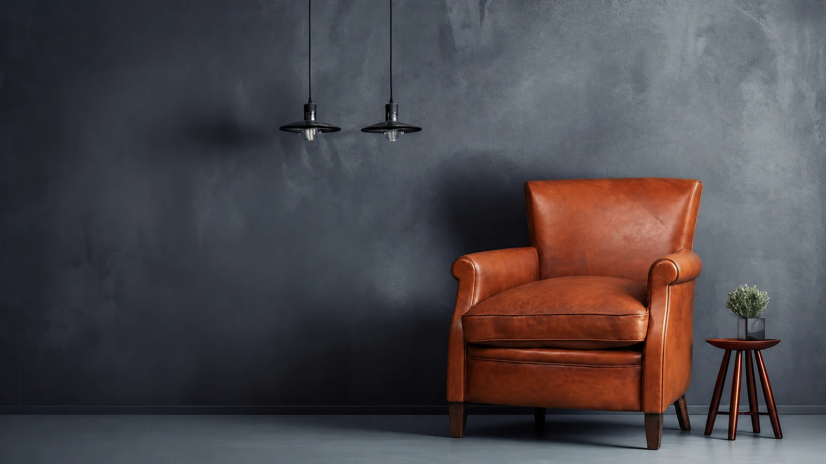 Khiam Cuir cognac armchair in a dark interior
